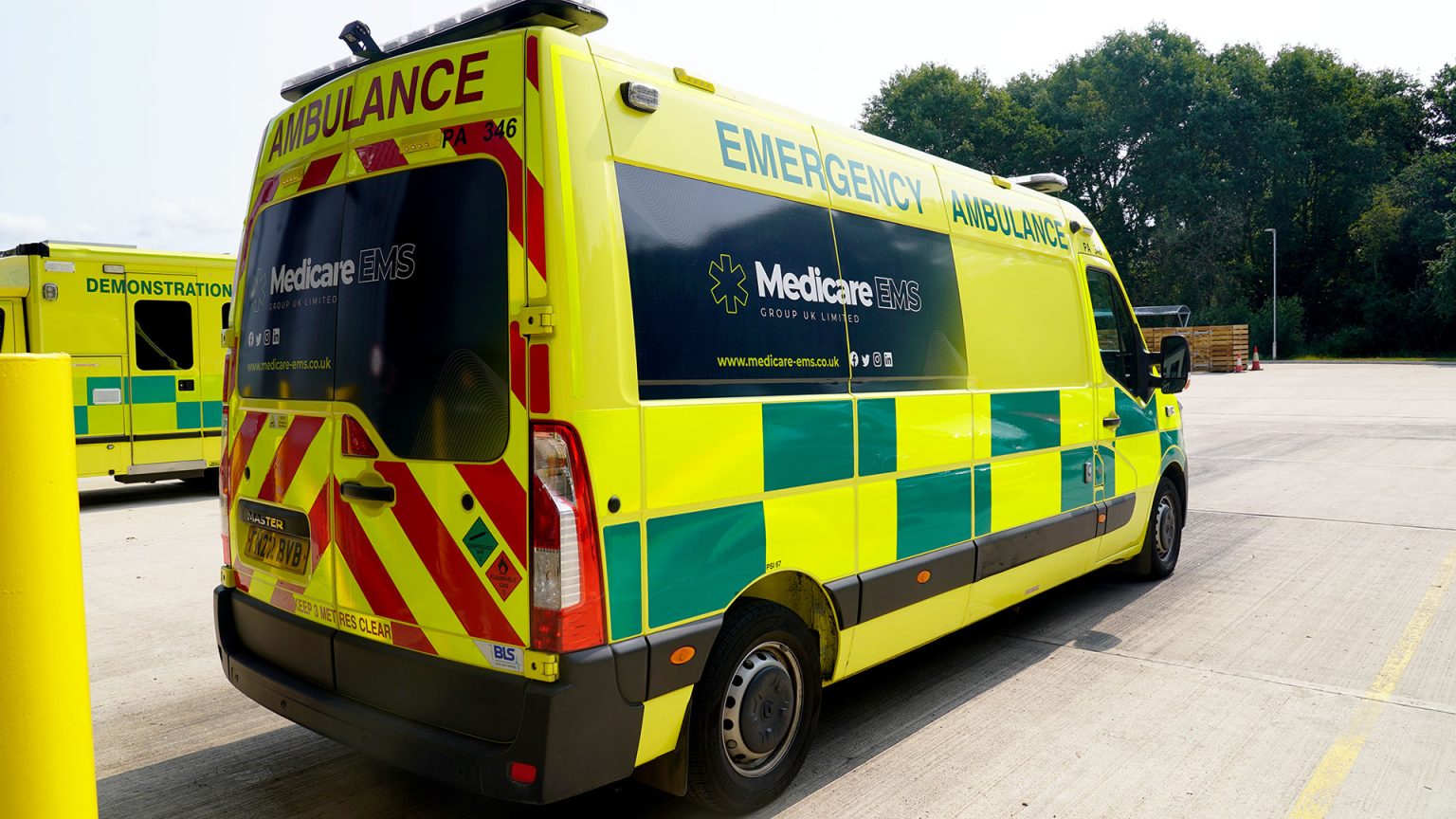 Angled shot of an ambulance, it looks very clean and brand new.
