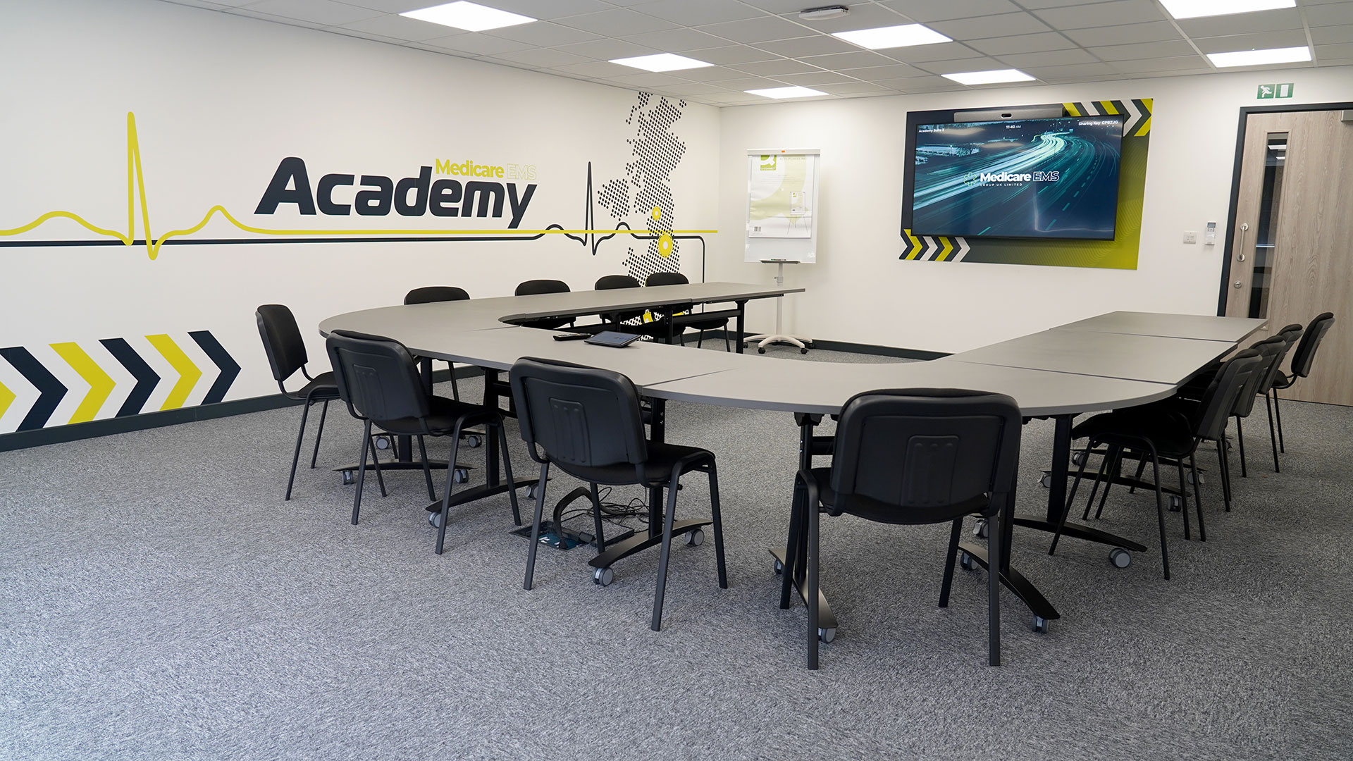 Boardroom- medicare on tv and academy logo along wall