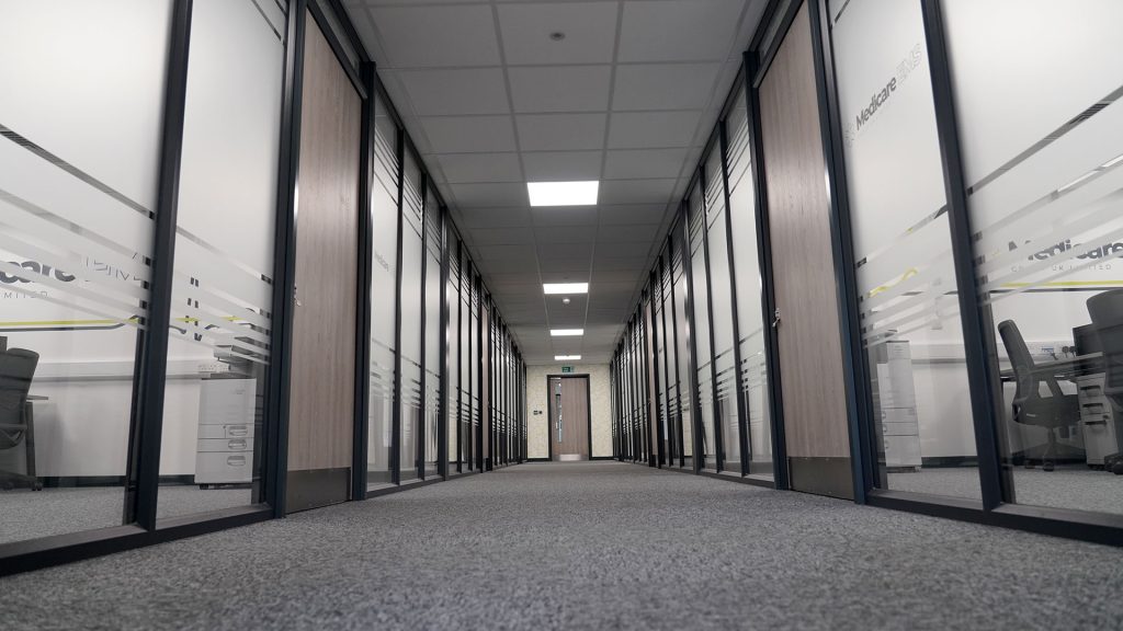 Low shot of medicare hallway showing various medicare logo's
